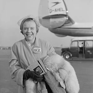 Mrs Eric Burt just stepping of the BOAC flight from the USA wearing "
