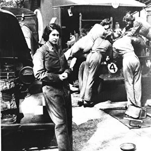 Princess Elizabeth standing by car wearing army Khaki uniform