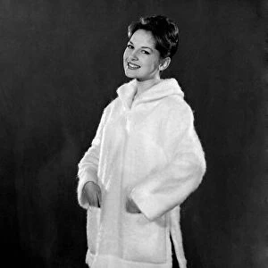 Reveille fashions 1960: Diana Lovell modelling a fake fur winter coat