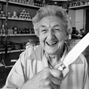 Shopkeeper Dorothy Gleave holding a knife that she used to chase away two armed teengaers