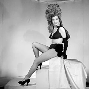 Showgirl wearing Easter Bonnet fancy dress. 1959