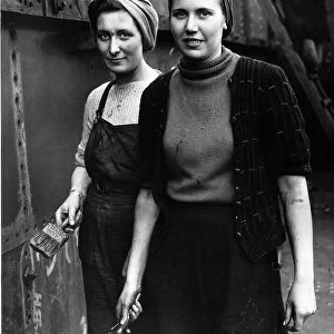 WW2 Wives of naval men working as painters in a shipyard 1942 Women Holding