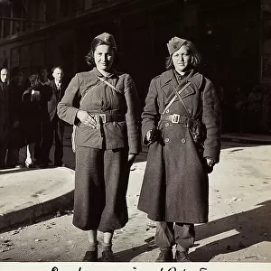 Portrait of two Yugoslavian partisan women in uniform, at the corner of Via Dante and il Corso, in Trieste