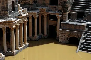 Mideast Prints: The 2nd century Roman amphitheatre is flooded following heavy rain in the historic