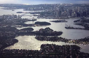 Aerial picture shows Sydney Harbour Bridge and Central Business District behind houses Aerial picture shows Sydney Harbour Bridge and Central Business District behind houses