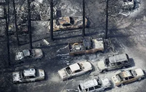 Fire Prints: An aerial view of burned out vehicles in the aftermath of the Black Forest Fire in Black