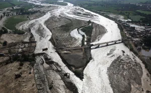 Peru Prints: Aerial view of a collapsed road after a massive landslide and flood in Trujillo