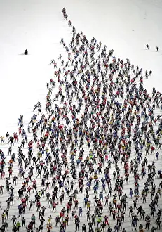 An aerial view of cross country skiers racing over the frozen lake Sils during