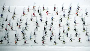 Trending: An aerial view of cross country skiers racing over the frozen lake Sils during