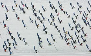Aerial view of cross country skiers racing over the frozen Lake Sils during the Engadin