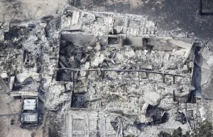 Fire Prints: An aerial view of a destroyed house in the aftermath of the Black Forest Fire in Black
