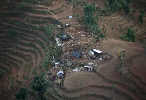 Quake Prints: An aerial view of houses damaged by Saturdays earthquake is seen in Dhading