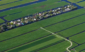 Aerial view of houses surrounded by water near Amsterdam