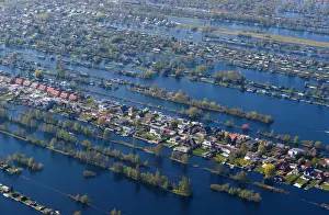 Netherlands Prints: Aerial view of houses surrounded by water near Amsterdam