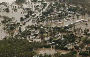 Prints of An aerial view of partially submerged houses in flooded Theodore in Australias state of Queensland January 2, 2011 Australia Prints: An aerial view of partially submerged houses in flooded Theodore in Australias state of