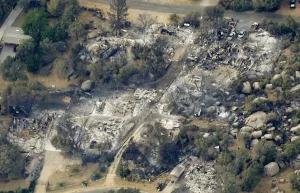 Prints of An aerial view of a section of the town of Yarnell, Arizona that is destroyed by a wildfire which ripped through the town is seen on July 1, 2013 USA Prints: Aerial view of a section of the town of Yarnell, Arizona destroyed by wildfire