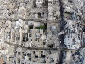 Mideast Prints: A aerial view shows a damaged mosque and surrounding buildings in the Al-Maysar