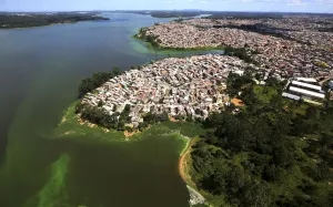 Prints of An aerial view of shows illegally built slums on the border of the polluted water of Billings reservoir in Sao Paulo February 12, 2015 Brazil Prints: An aerial view of shows illegally built slums on the border of the polluted water of