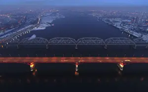 Prints of An aerial view shows the illuminated Nikolaevsky highway bridge and a bridge of the Trans-Siberian railway over the Yenisei river in Krasnoyarsk, Russia March 6, 2018. REUTERS/Ilya Naymushin Russia Prints: An aerial view shows the illuminated Nikolaevsky highway bridge