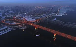 : An aerial view shows the illuminated Nikolaevsky highway bridge