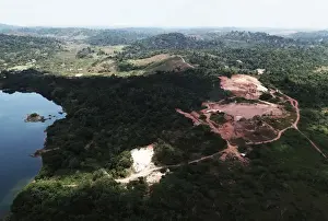Environment Prints: An aerial view shows the location of an illegal gold mine as its machines are destroyed