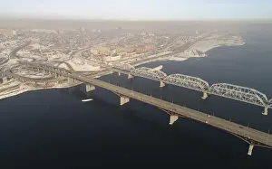 Prints of An aerial view shows the Nikolaevsky highway bridge and a bridge of the Trans-Siberian railway over the Yenisei river in the haze covered city of Krasnoyarsk, Russia March 6, 2018 Russia Prints: An aerial view shows the Nikolaevsky highway bridge and a bridge of the Trans-Siberian