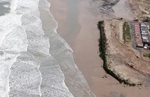France Prints: An aerial view shows a sea wall on the beach that protects camping sites