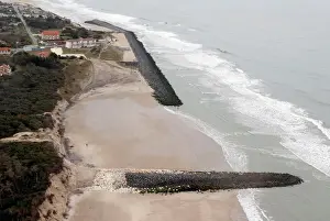 Coastline Prints: An aerial view shows sea walls on the beach that protect sand dunes from erosion along