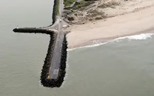 Coastline Prints: An aerial view shows sea walls on the beach that protect sand dunes from erosion along