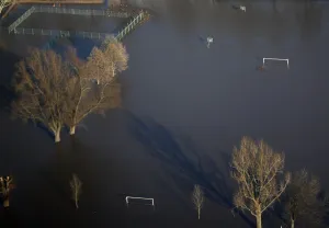 An aerial view shows a submerged soccer field at the flooded riverside of the Rhine An aerial view shows a submerged soccer field at the flooded riverside of the Rhine