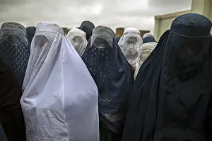 Afghan women wait to cast their ballots at a polling station in Mazar-i-Sharif