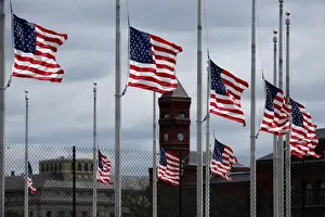 Weather Prints: American flags fly as a storm producing strong winds passes through Washington