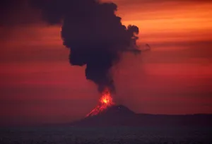 Indonesia Prints: Anak Krakatau (Child of Krakatoa) volcano is seen from Japanese helicopter carrier Kaga