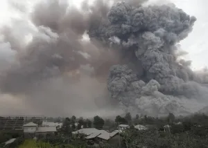 Indonesia Prints: An ash cloud from a Mount Sinabung eruption is seen from Kuta Tengah village in Karo