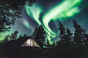 The Aurora Borealis (Northern Lights) is seen in the sky in Ivalo of Lapland