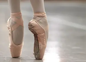 A ballet dancer performs on blocked shoes during a classical class at the Prix de