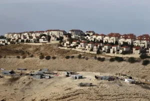Images Dated 2012 December: A Bedouin encampment of the Jahalin tribe is seen in front of the Jewish settlement of
