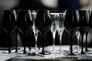 Black glasses specially designed for wine blind testing are seen on a table during