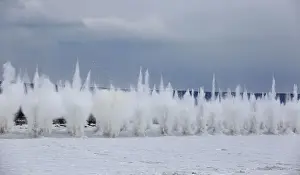 A blast rips through the ice covering the Kan river to reduce the risk of floods