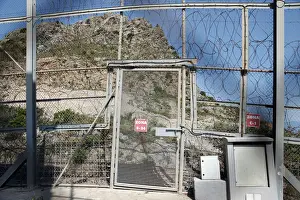 Migrant Prints: The border fence separating Spains northern enclave Ceuta and Morocco is seen from Ceuta