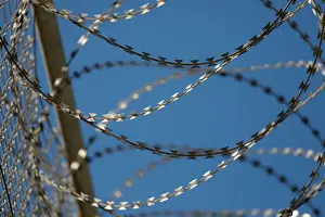 Migrant Prints: The border fence separating Spains northern enclave Ceuta and Morocco is seen from Ceuta