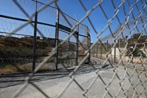 Migrant Prints: The border fence separating Spains northern enclave Ceuta and Morocco is seen from Ceuta