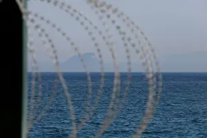 Migrant Prints: The border fence separating Spains northern enclave Ceuta and Morocco is seen from Ceuta