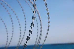 Migrant Prints: The border fence separating Spains northern enclave Ceuta and Morocco is seen from Ceuta
