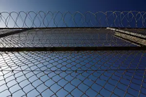 Migrant Prints: The border fence separating Spains northern enclave Ceuta and Morocco is seen from Ceuta