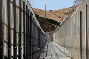 Migrant Prints: The border fence separating Spains northern enclave Ceuta and Morocco is seen from Ceuta
