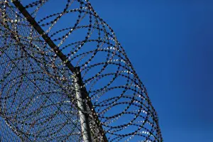 Migrant Prints: The border fence separating Spains northern enclave Ceuta and Morocco is seen from Ceuta