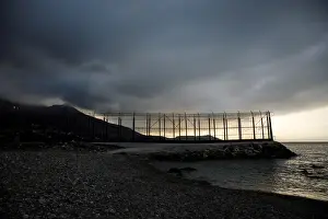 Migrant Prints: The border fence separating Spains northern enclave Ceuta and Morocco is seen from Ceuta