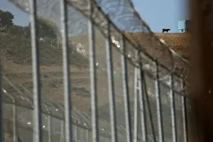Migrant Prints: The border fence separating Spains northern enclave Ceuta and Morocco is seen from Ceuta
