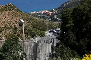 Migrant Prints: The border fence separating Spains northern enclave Ceuta and Morocco is seen from Ceuta